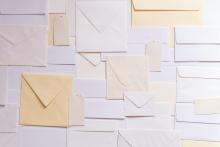 Wall of mail envelopes